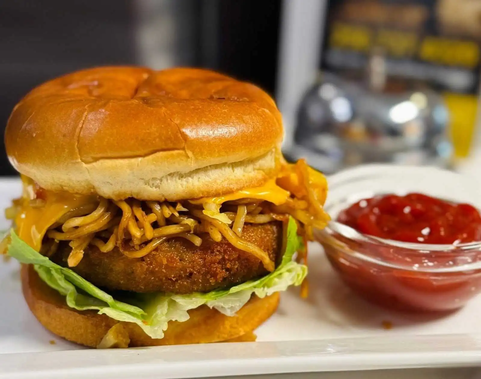 Noodle tikki burger at Royal Bistro Duncan BC - crispy noodle patty burger with Indian spices